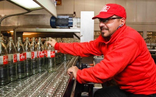 Quality Control - checking bottles on the production line
